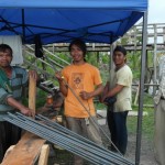 Foreman Jaime Poli (on right) survived Typhoon Haiyan by running to the mountains ahead of huge waves.