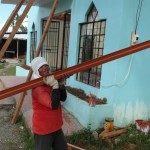 Worker Carries Steel Purlin