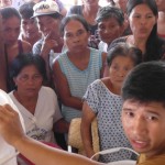 Typhoon survivors wait for water filters