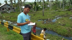 Pastor Jun Romawac Counts Roofing Sheets